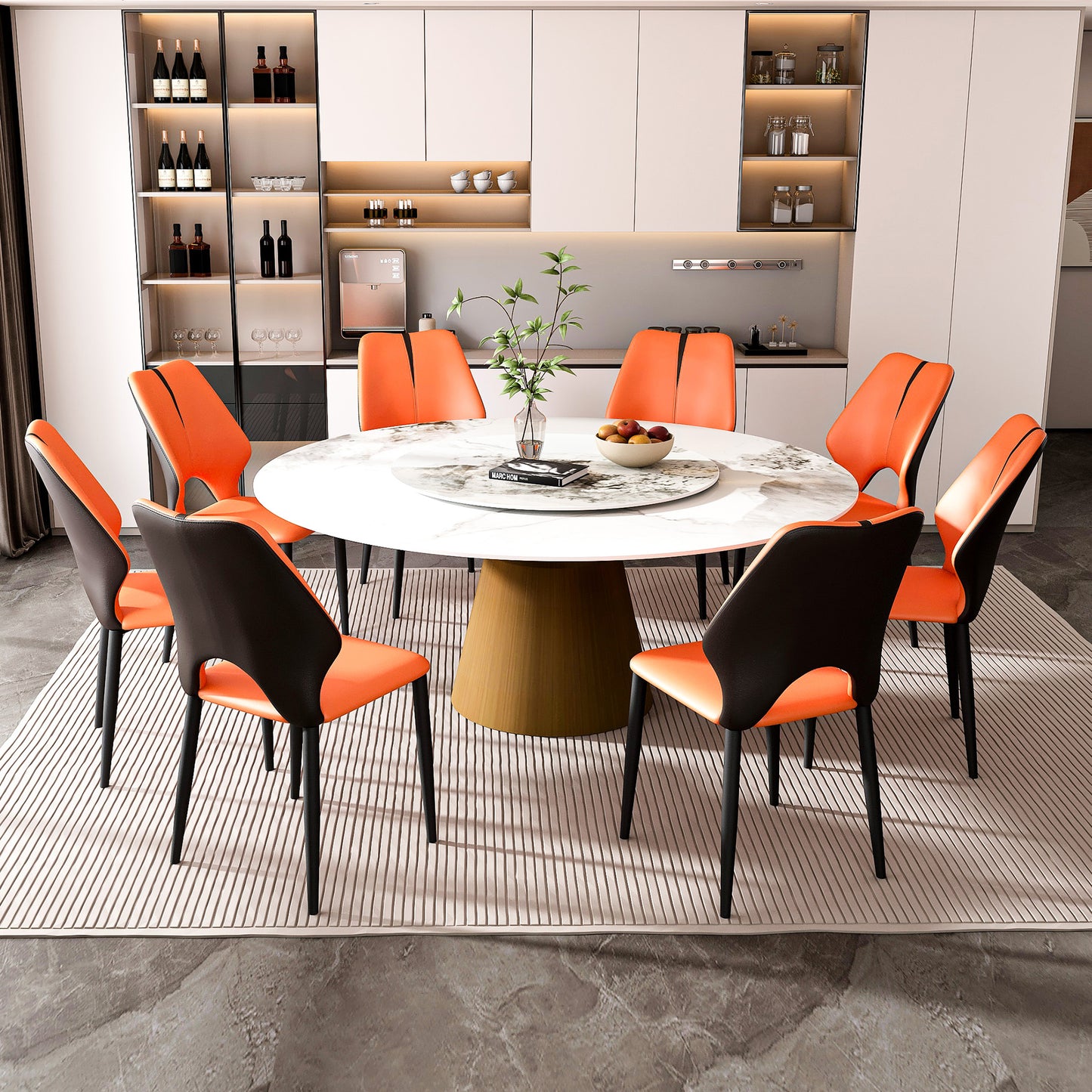 Modern dining set with  orange and black upholstered chairs around a round marble table