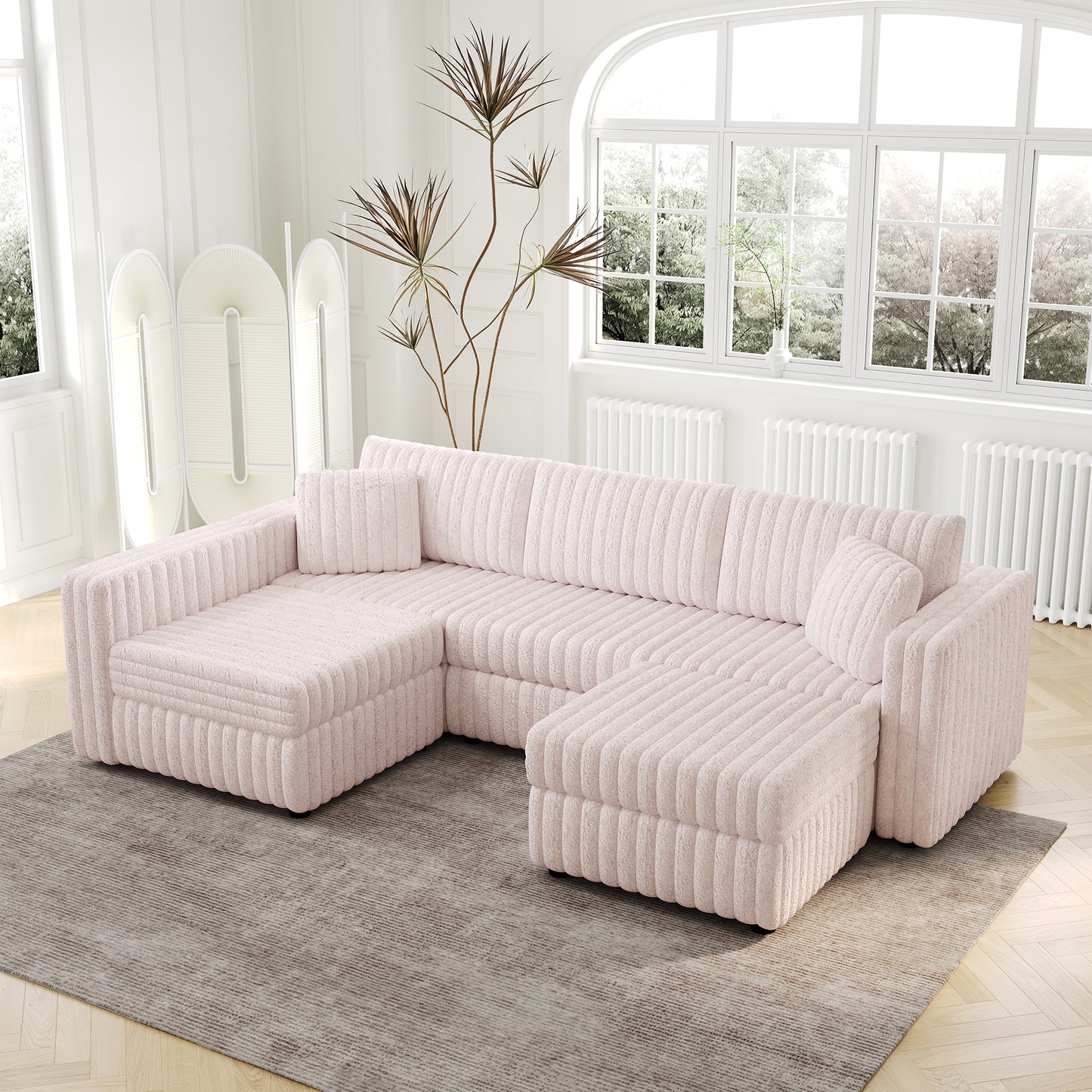 Soft pink chenille Ushaped sectional sofa with vertical tufting on a modern living room floor