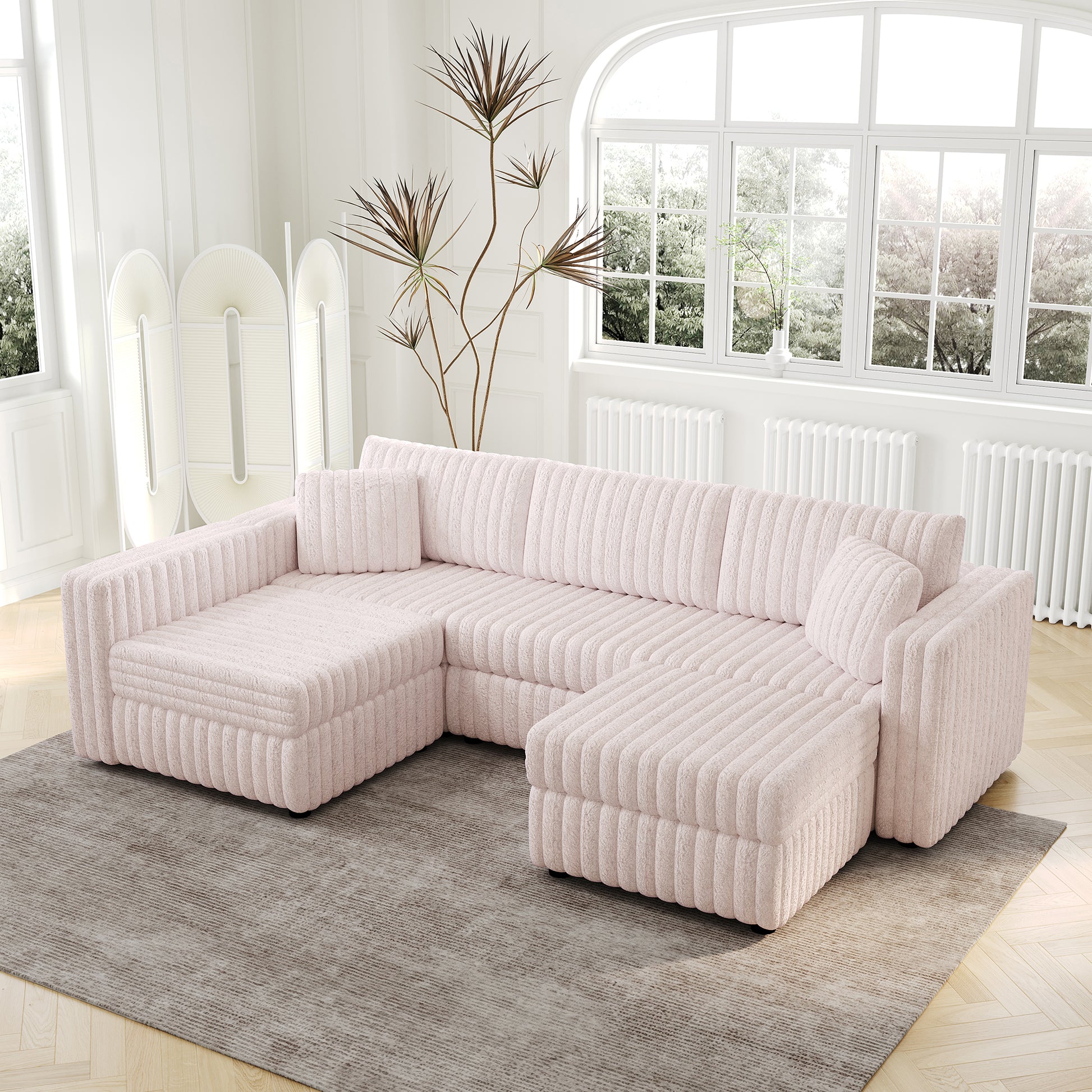Soft pink chenille Ushaped sectional sofa with vertical tufting on a modern living room floor