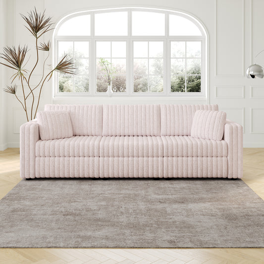 Plush pink ribbed sofa with two accent pillows and clean lines ideal for modern living rooms