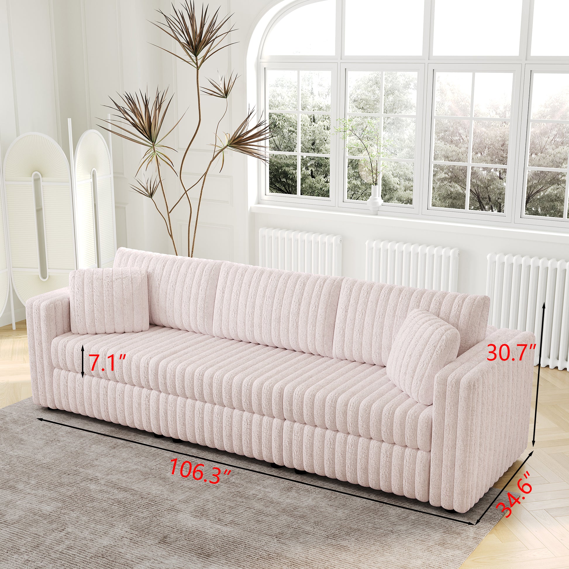 Plush pink corduroy sofa with ribbed texture and two matching throw pillows perfect for modern living rooms