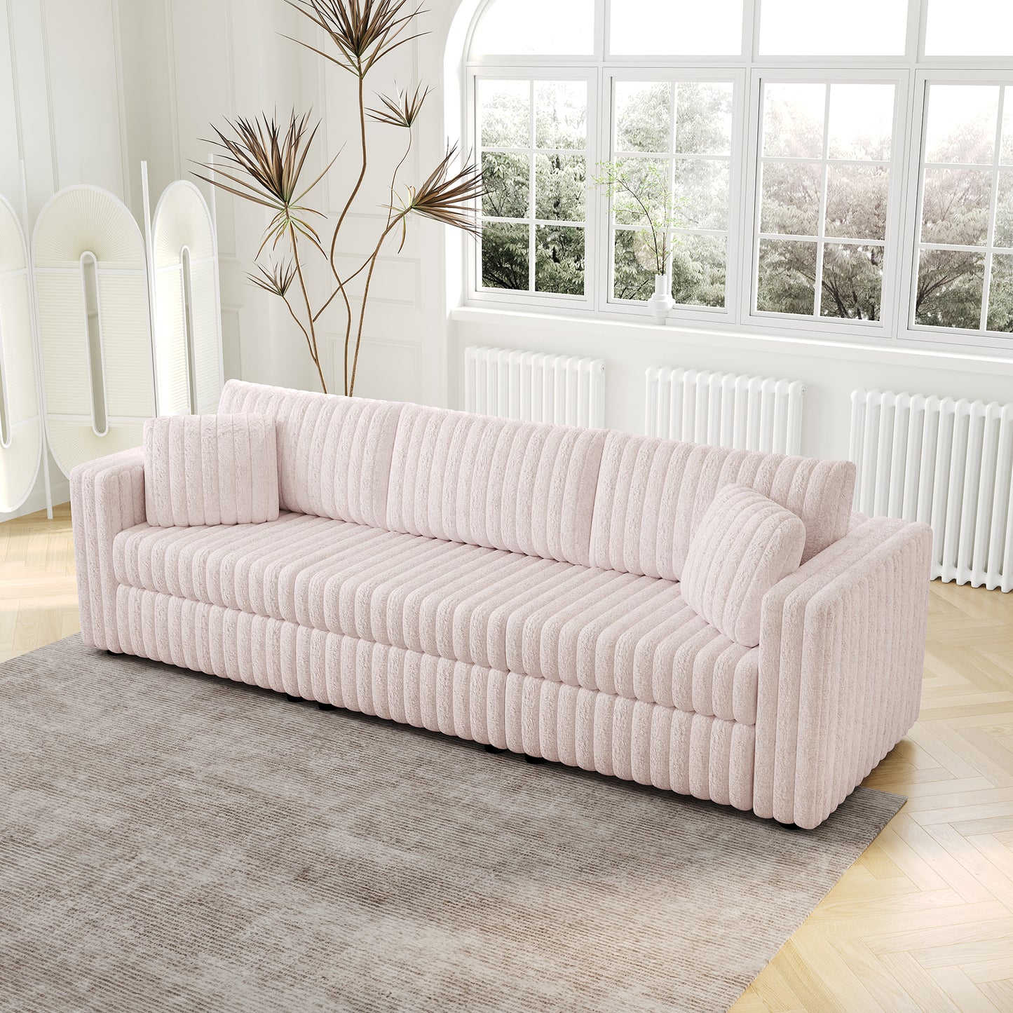 Soft pink corduroy sofa with plush texture and vertical ribbing