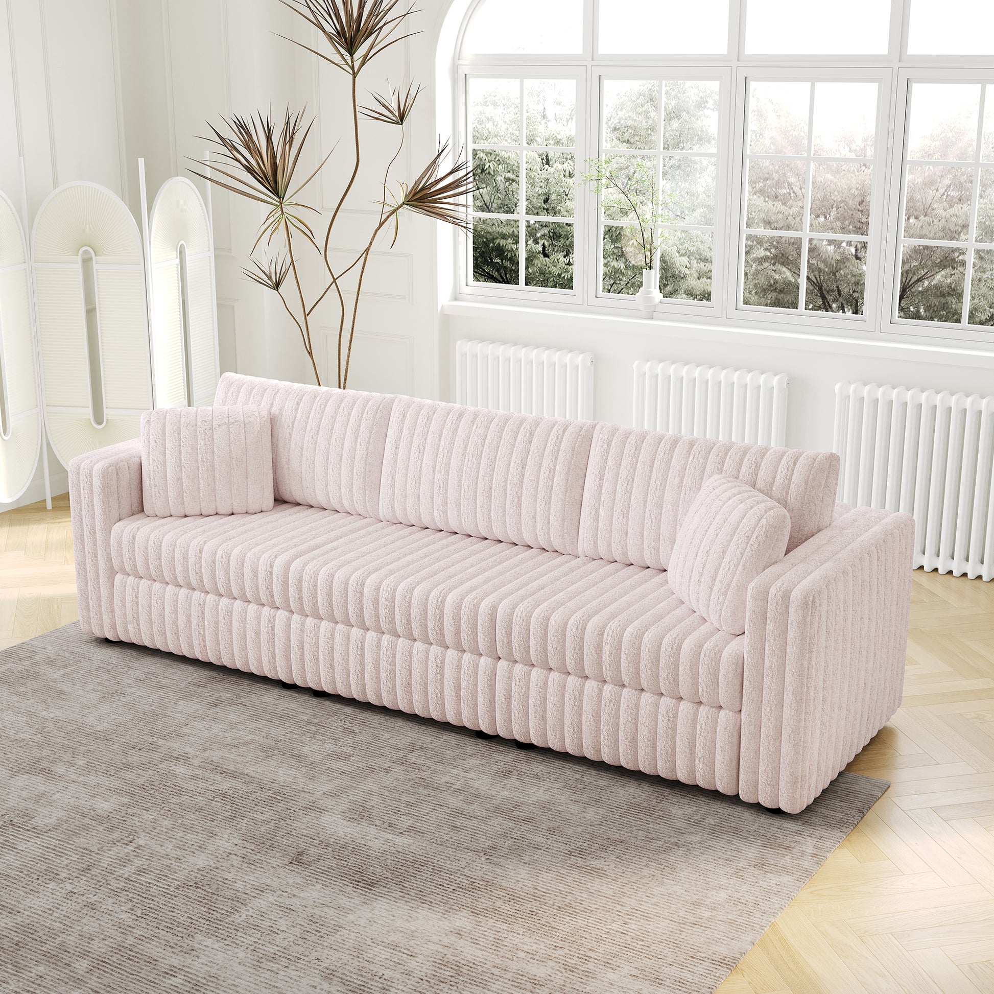 Soft pink corduroy sofa with plush texture and vertical ribbing