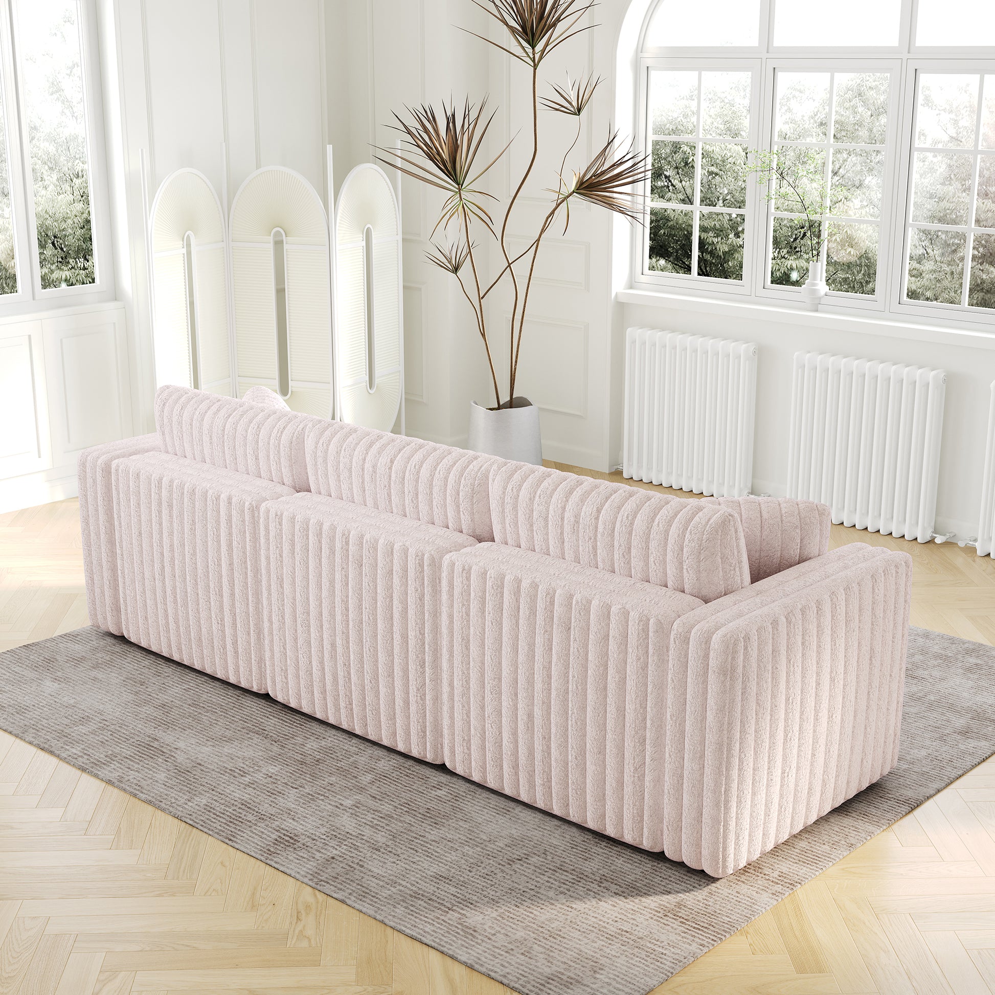 Textured pink sofa with channel tufting perfect for modern living rooms
