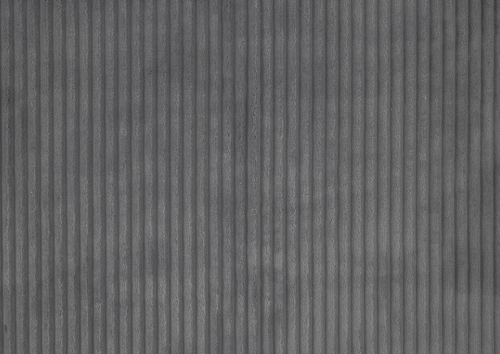 Closeup of gray corduroy fabric texture with vertical ribs perfect for upholstery
