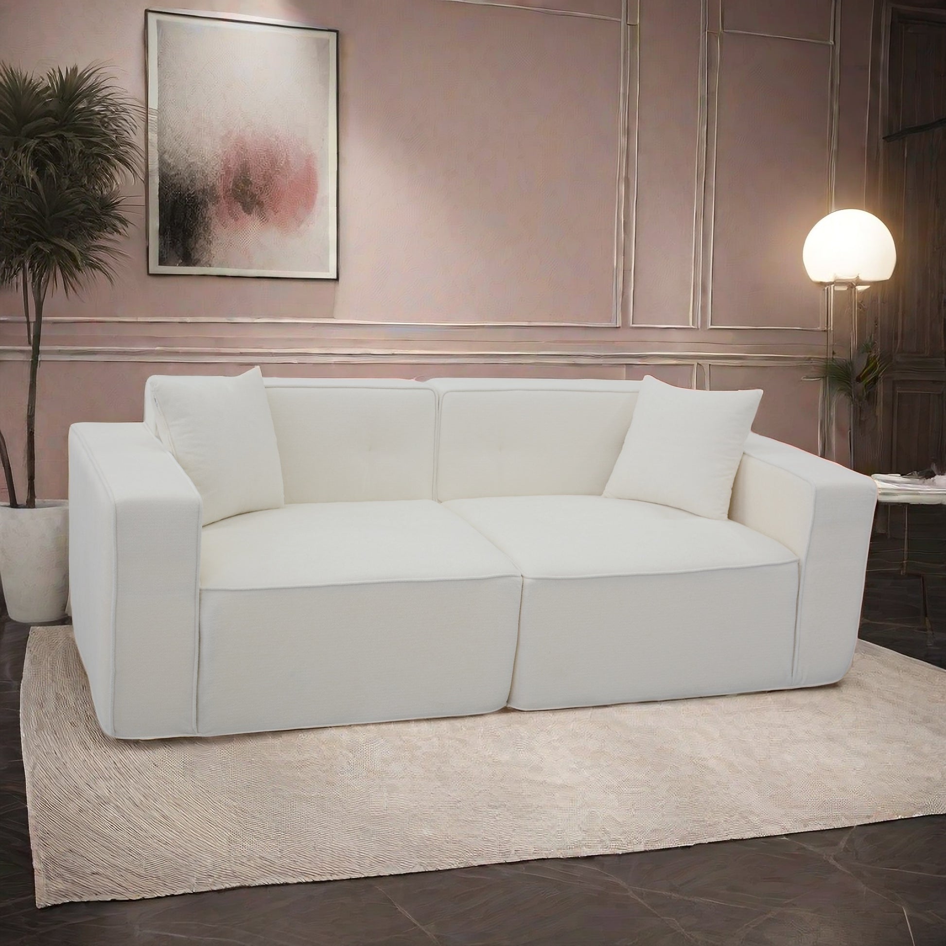 Comfortable offwhite fabric sectional sofa with tufted cushions and minimalist design