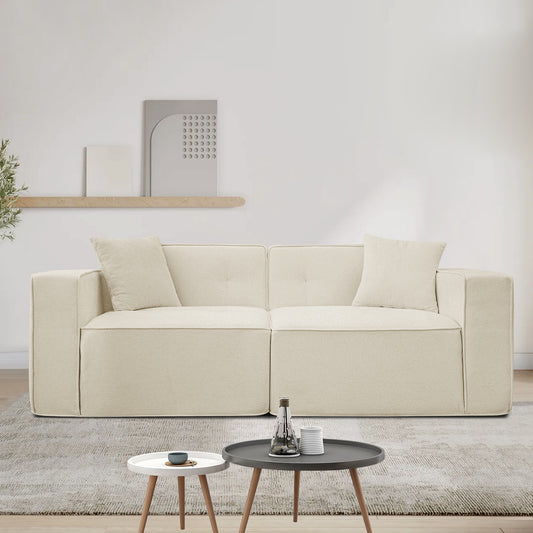 Cream boucle fabric sectional sofa with two throw pillows modern living room seating
