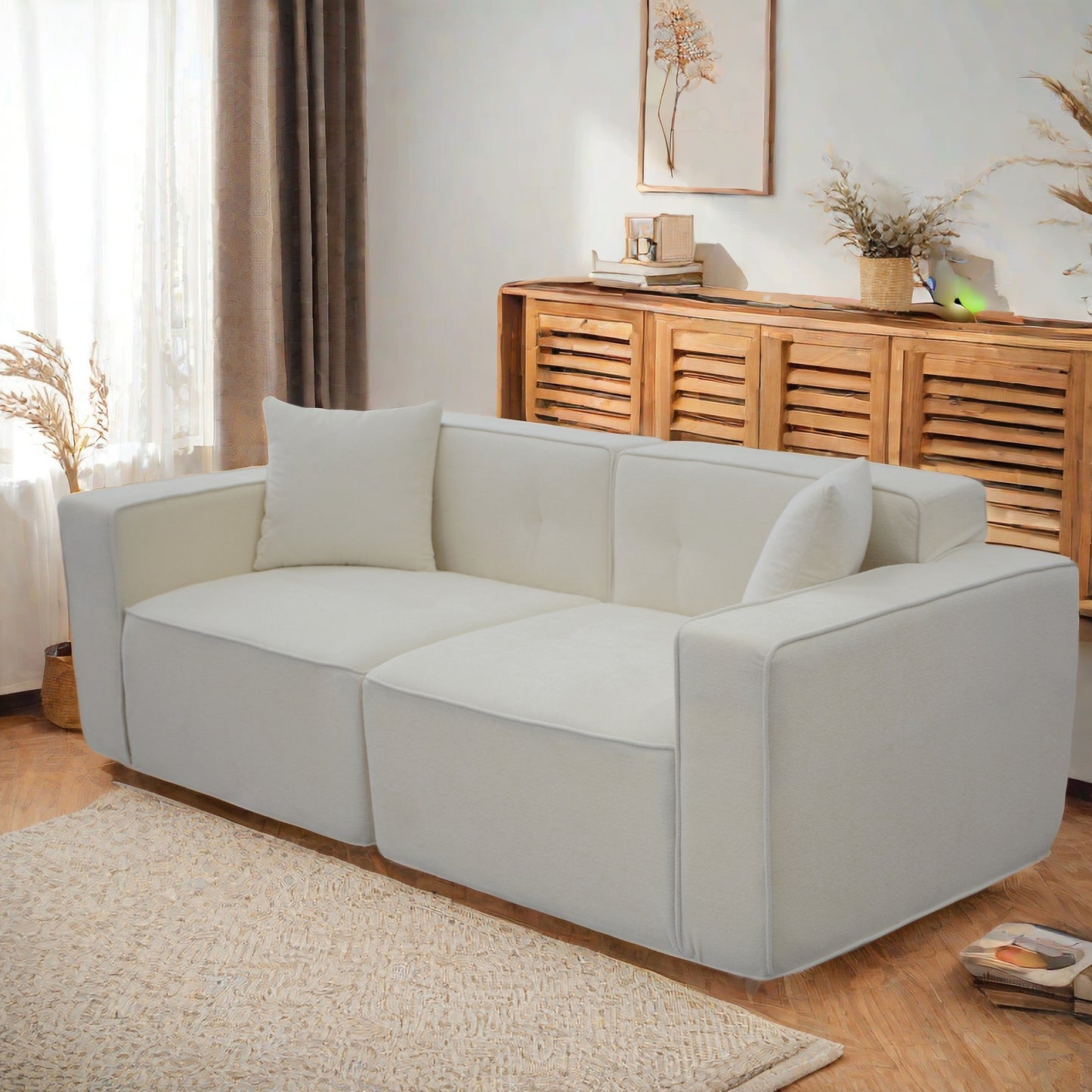 Modern white linen sofa with clean lines and plush cushions for a contemporary living room