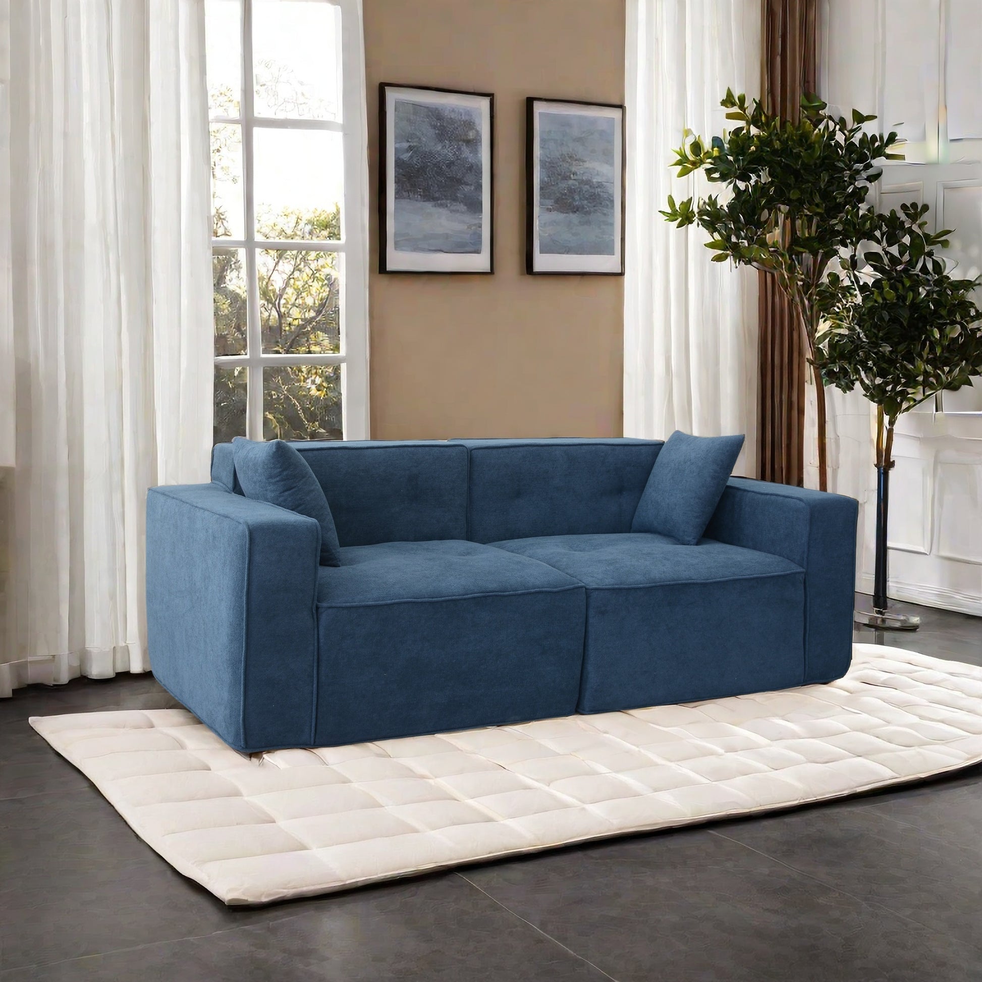 Modular navy blue fabric sofa with plush cushions and modern design