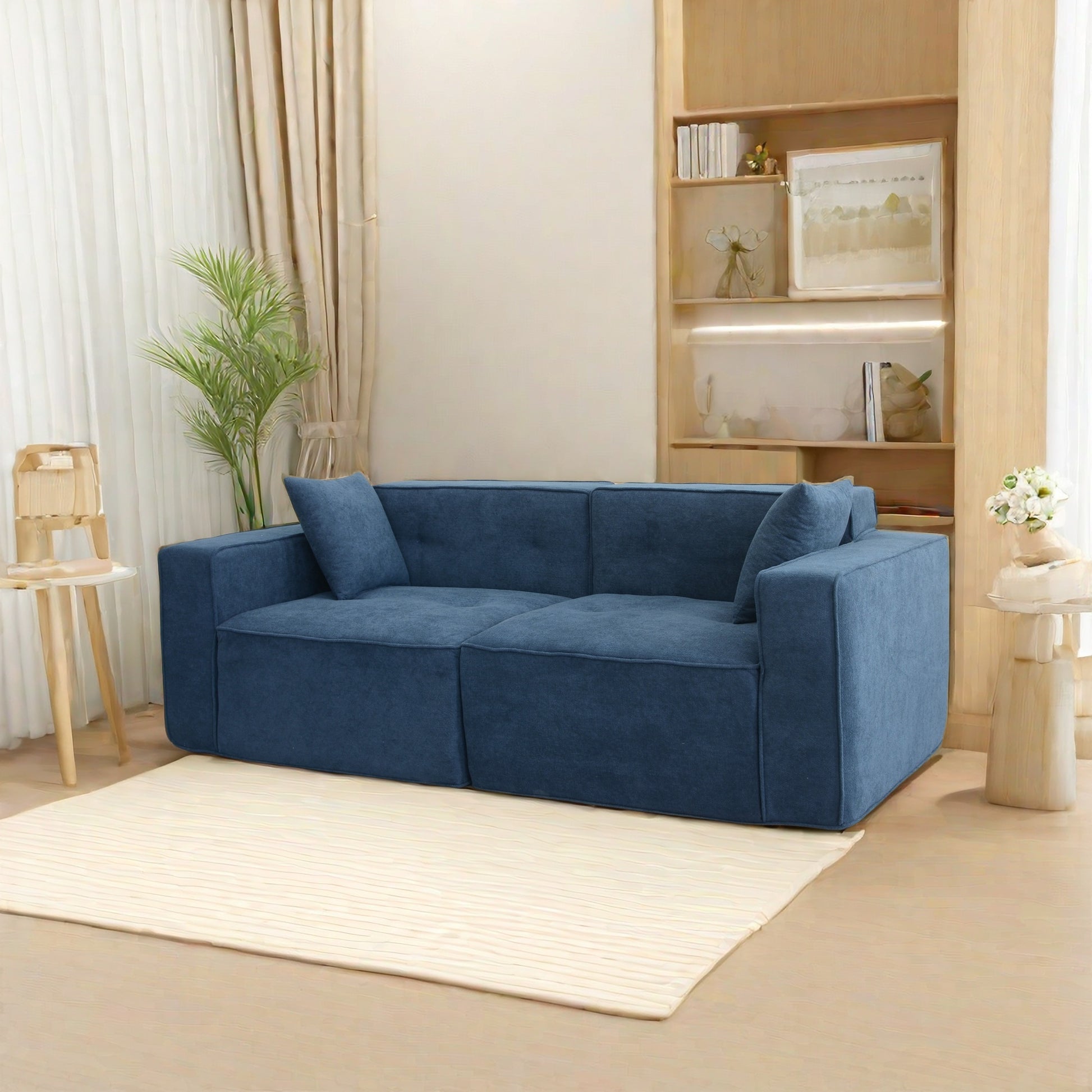 Plush navy blue fabric sectional sofa with deep seating and modern clean lines