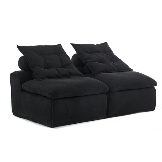 Plush black corduroy modular sofa with deep seats and tufted back cushions