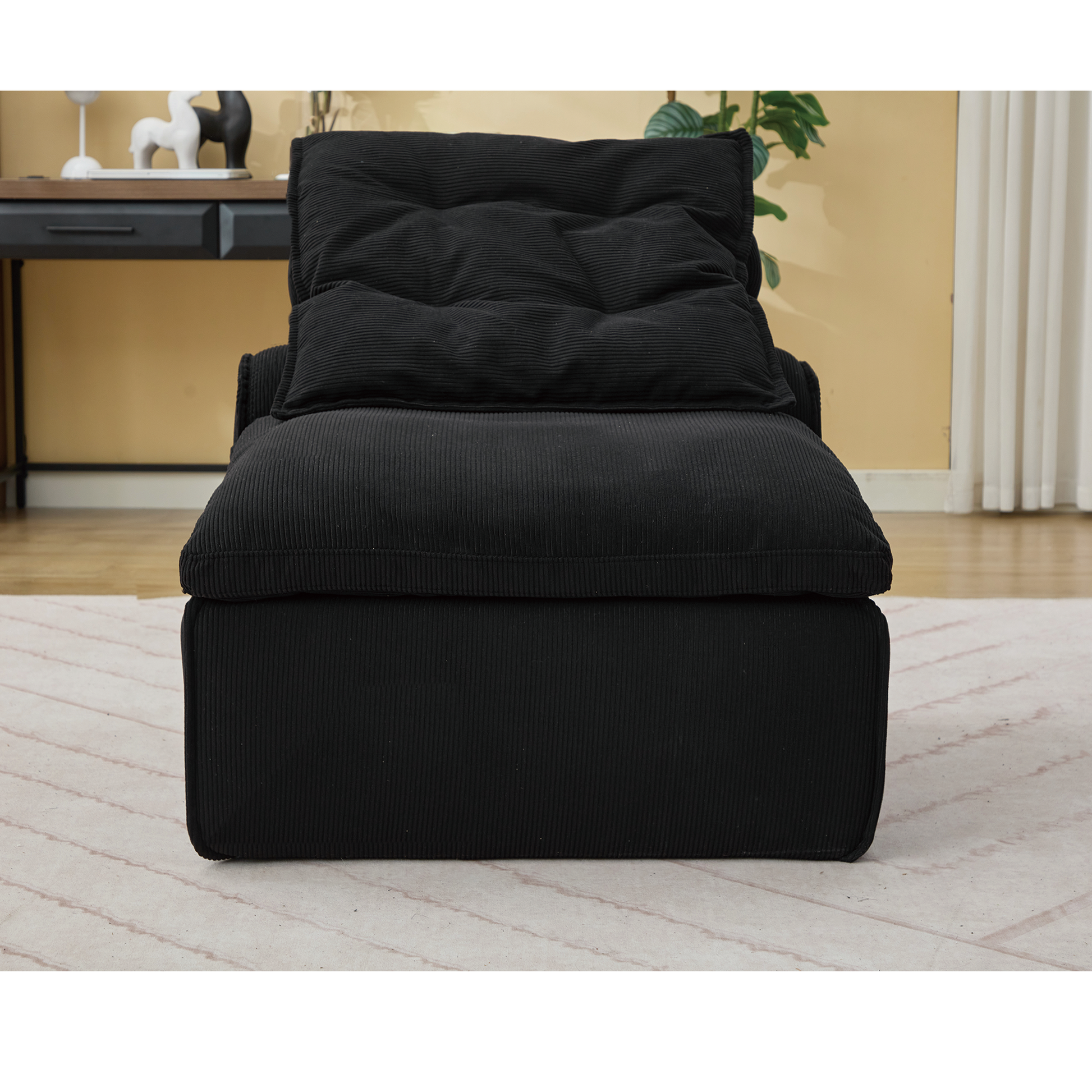 Plush black corduroy accent chair with overstuffed cushions perfect for cozy living spaces