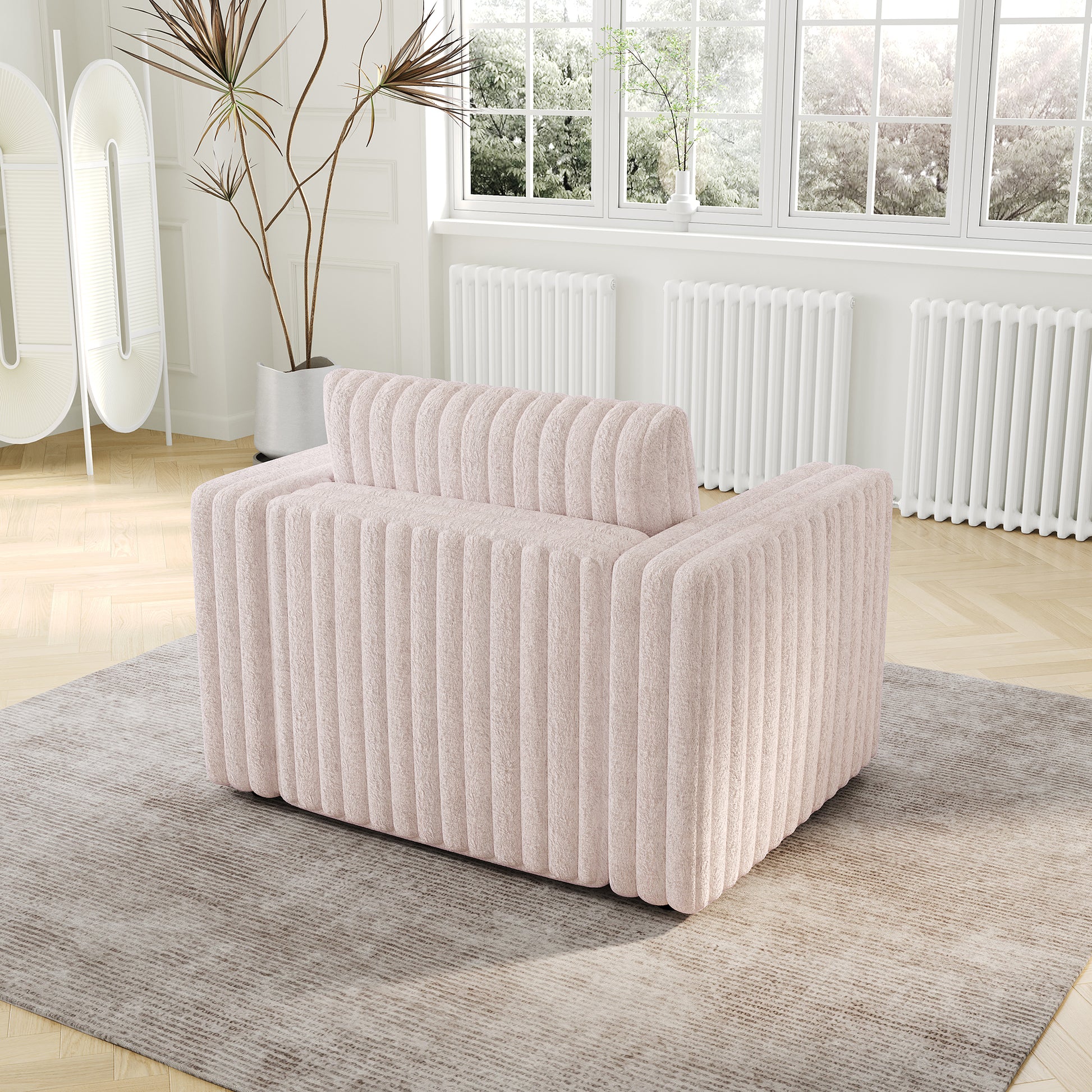 Plush pink armchair with vertical channel tufting modern accent seating