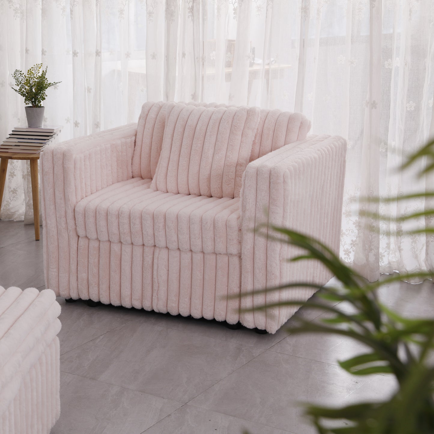 Plush pink armchair with vertical ribbed texture perfect for cozy living rooms