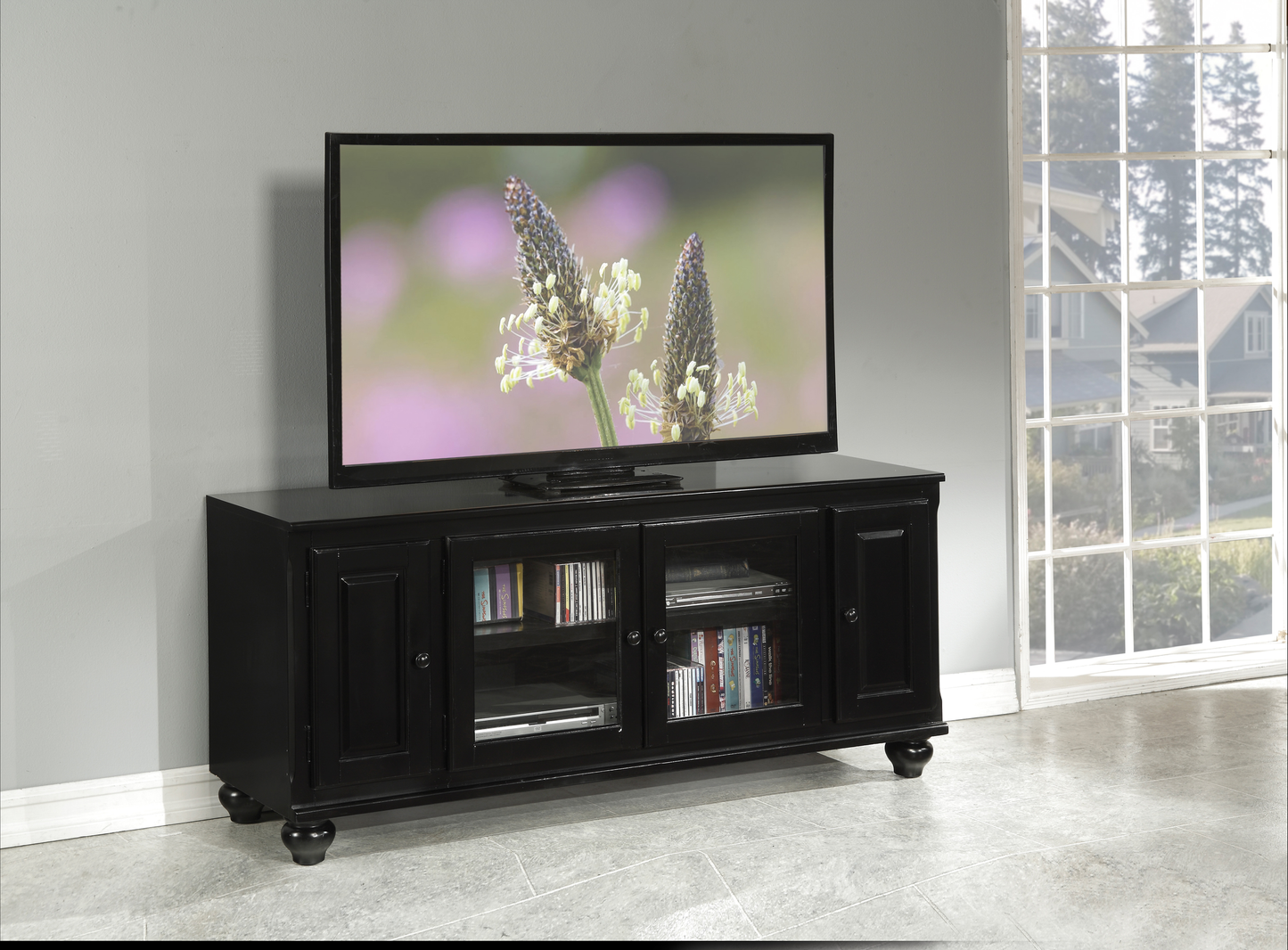 Classic black TV stand with glass doors and tiered shelving for media storage