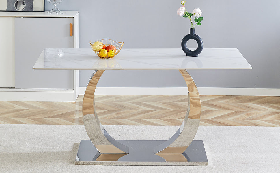 White marble top dining table with polished chrome Cshaped pedestal base