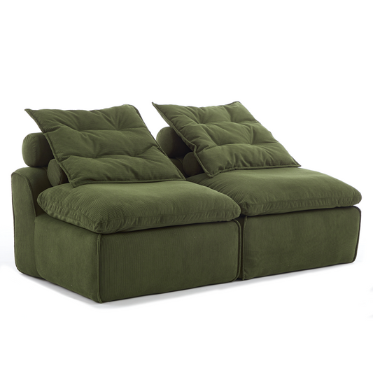 Plush green corduroy sofa with deep tufted cushions perfect for a cozy living room