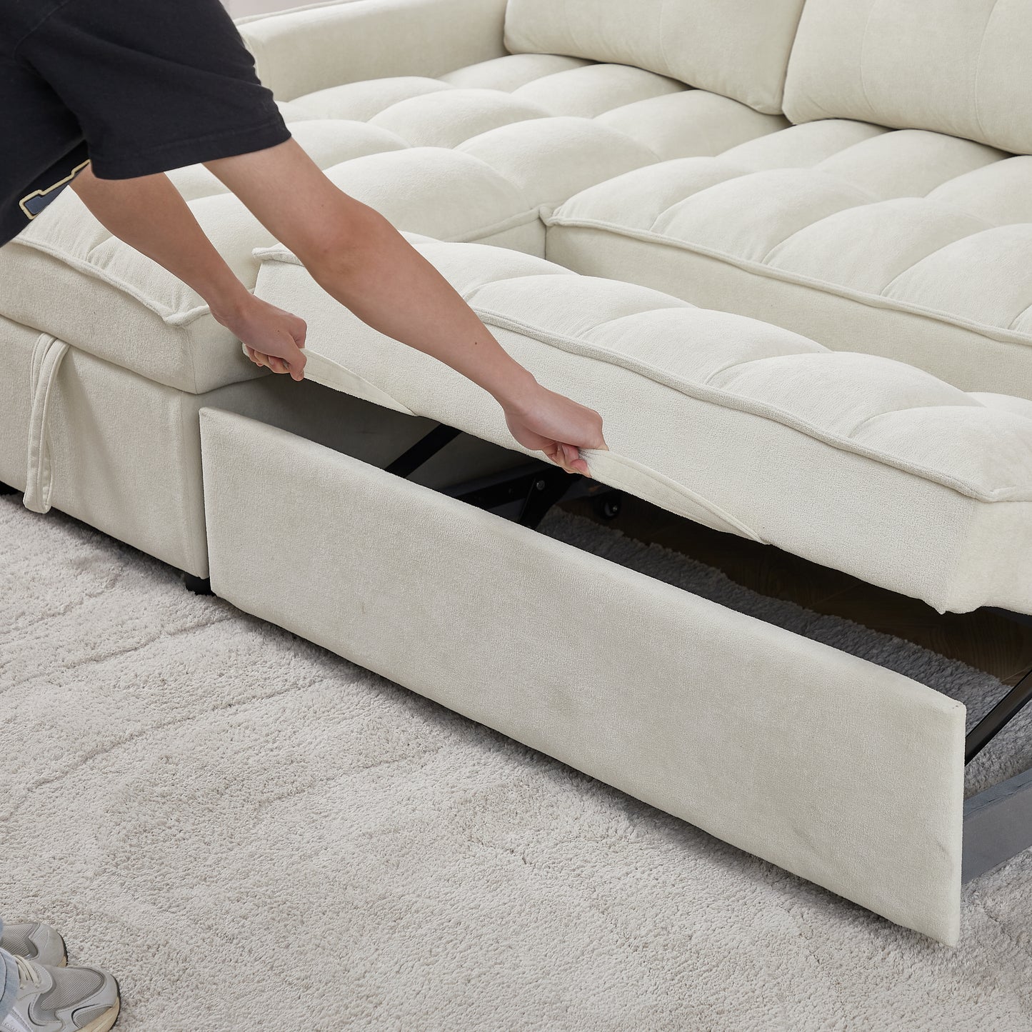 Cream sectional sofa with pullout bed feature plush tufted cushions