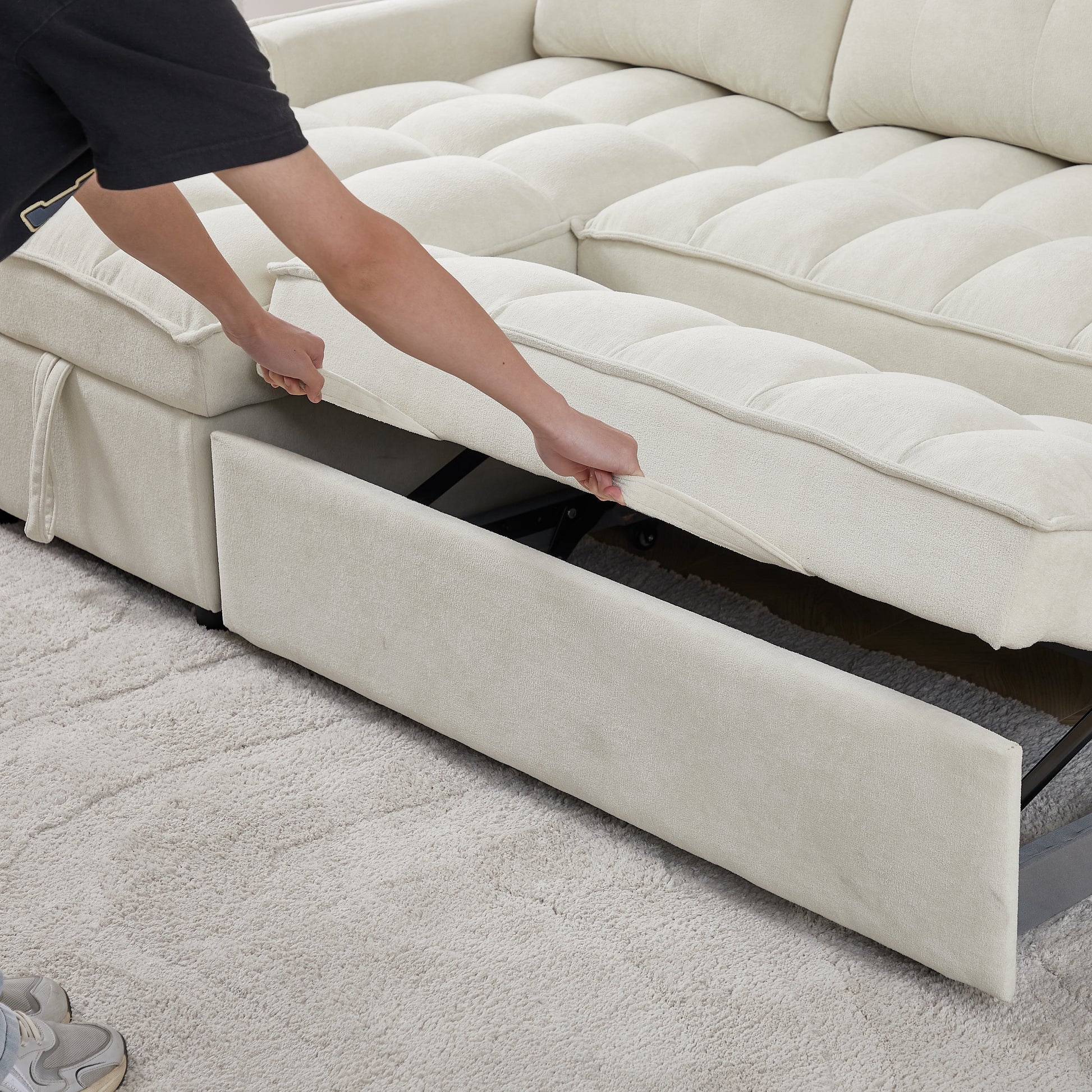 Cream sectional sofa with pullout bed feature plush tufted cushions