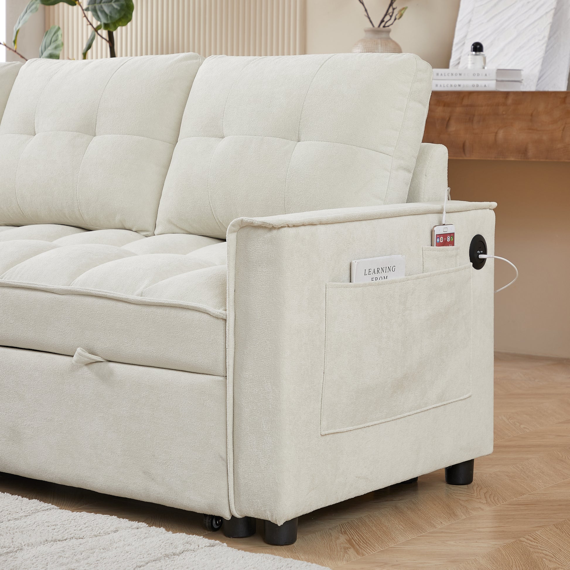Cream fabric sofa with tufted cushions side pocket and integrated USB charging ports