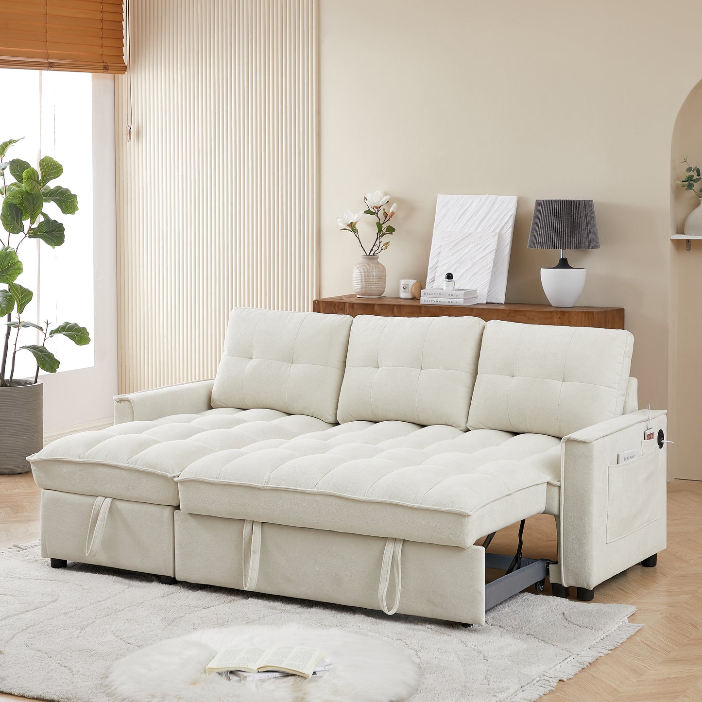 Cream upholstered sofa bed with tufted cushions and storage pockets