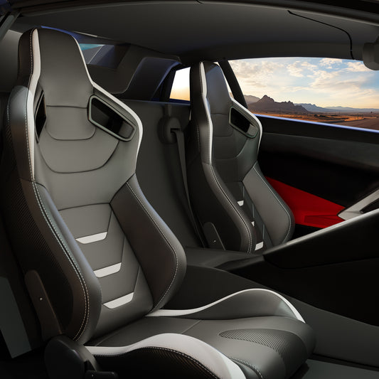 Black leather sport bucket seats with white stitching and gray accents for a performance car