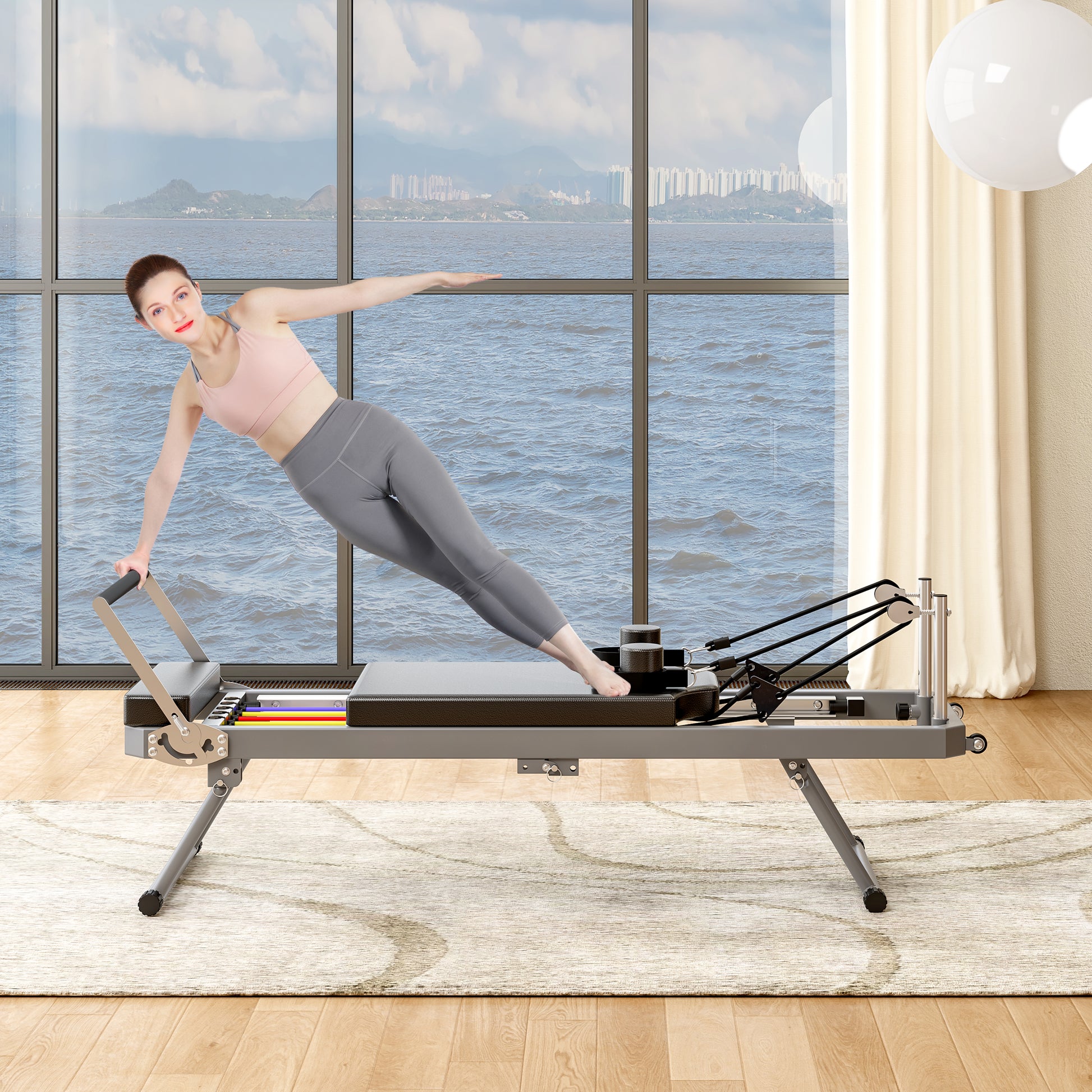Professional Pilates reformer machine in gray and black with adjustable resistance bands for home workouts
