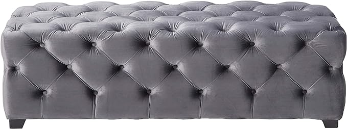 Tufted grey velvet ottoman with diamond button tufting perfect for a living room accent