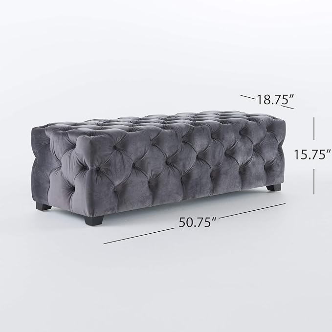 Tufted velvet storage ottoman in charcoal gray with diamond button tufting and dark wood legs