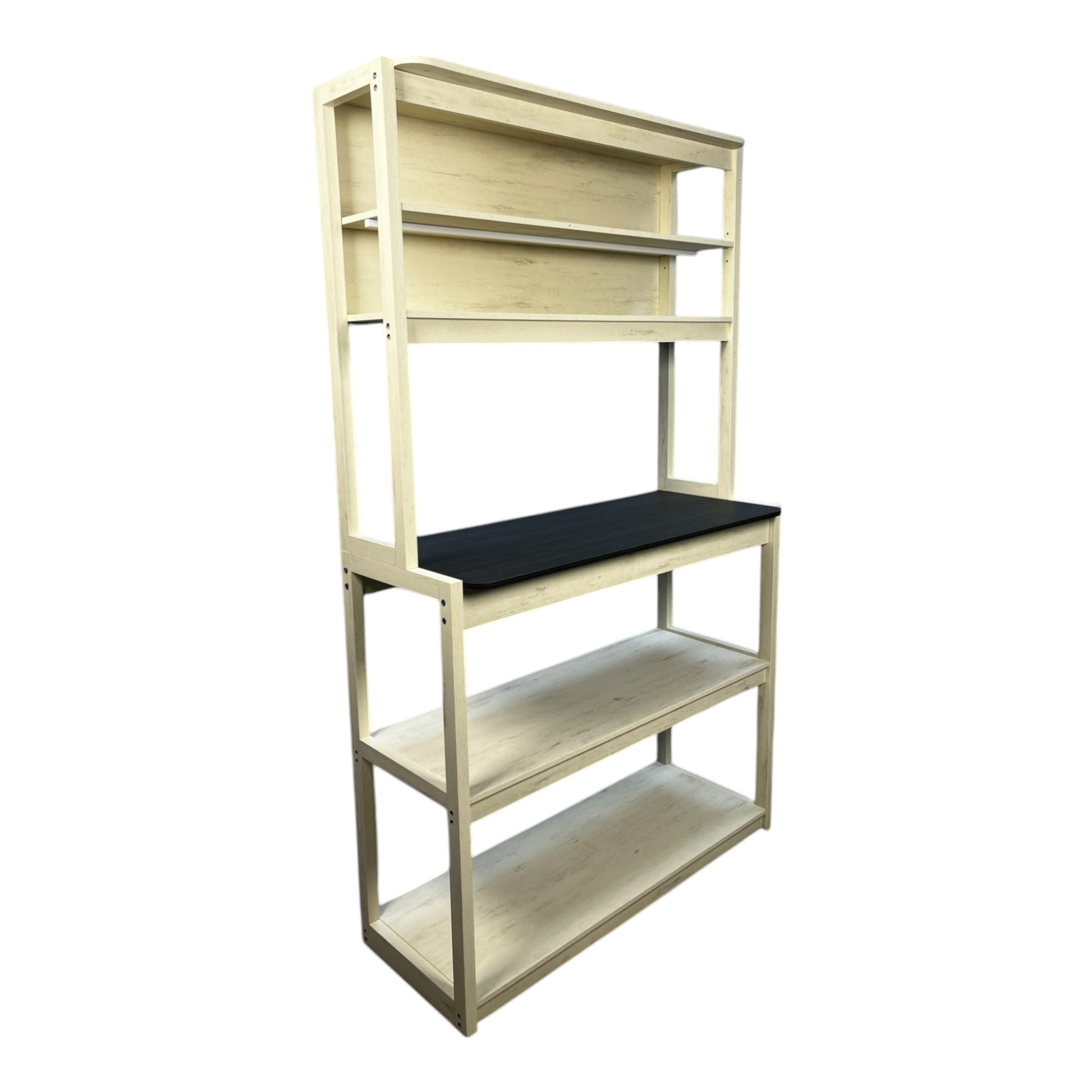Light cream distressed wood bakers rack with a black countertop and four shelves