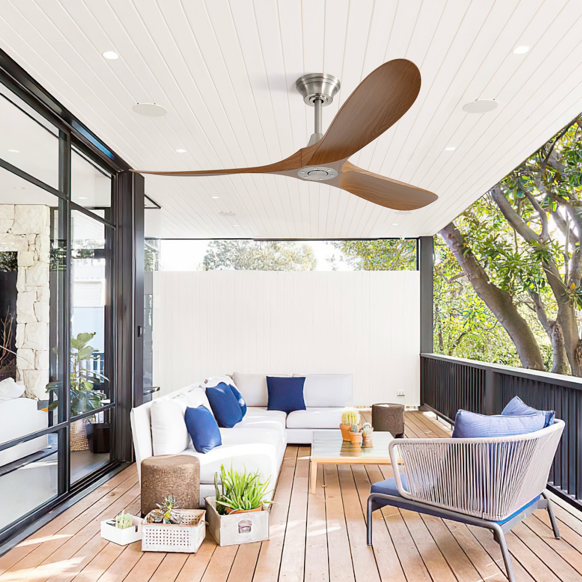 Threebladed wooden ceiling fan with brushed nickel finish on white wood paneling