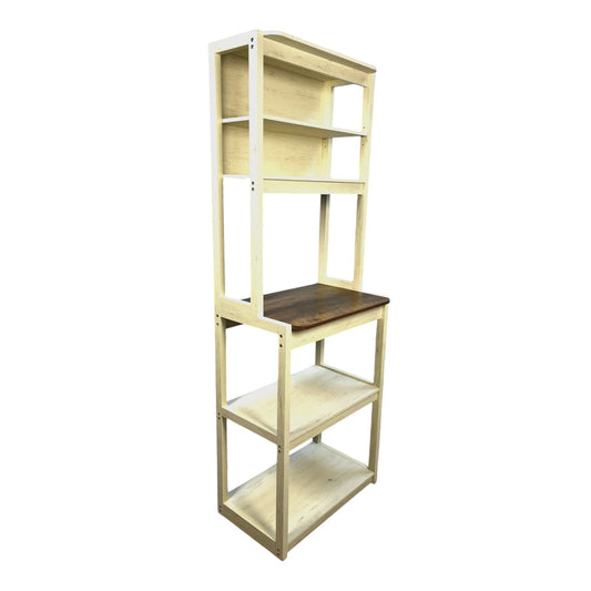 Cream distressed wood bakers rack with multiple shelves and a dark wood countertop