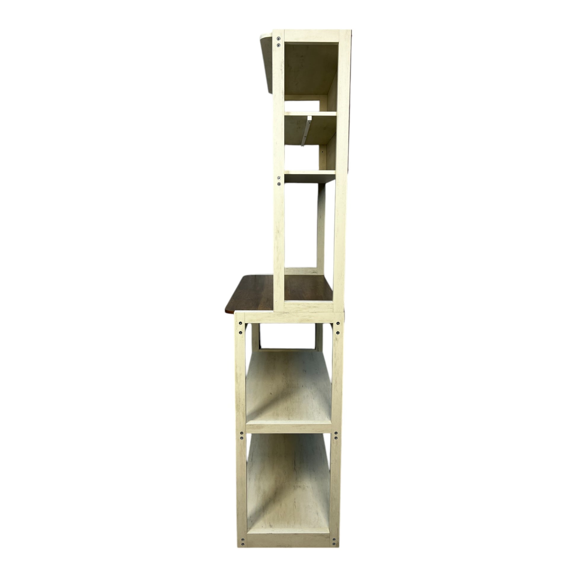 Rustic tiered shelving unit with a cream distressed finish and a dark wood shelf