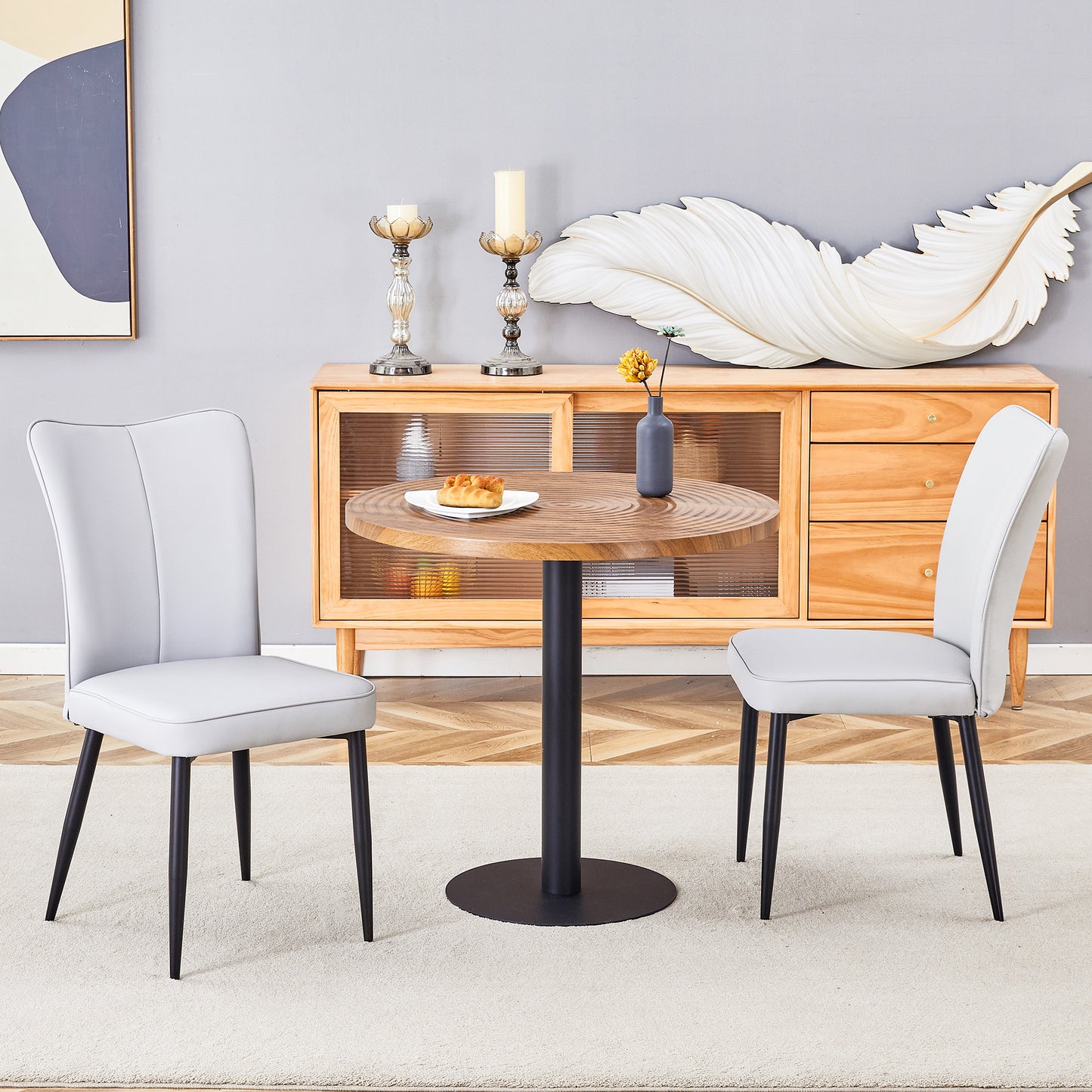 Light gray upholstered dining chair with black tapered legs modern style