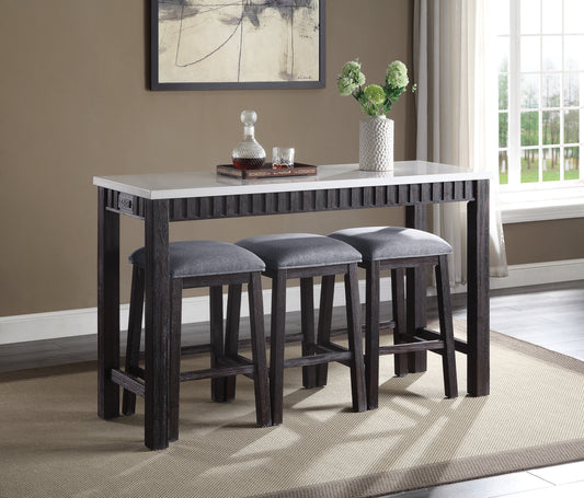 Dark wood counter table with white top and three grey upholstered stools