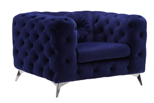 Plush navy velvet armchair with deep button tufting and chrome legs ideal for living room accent