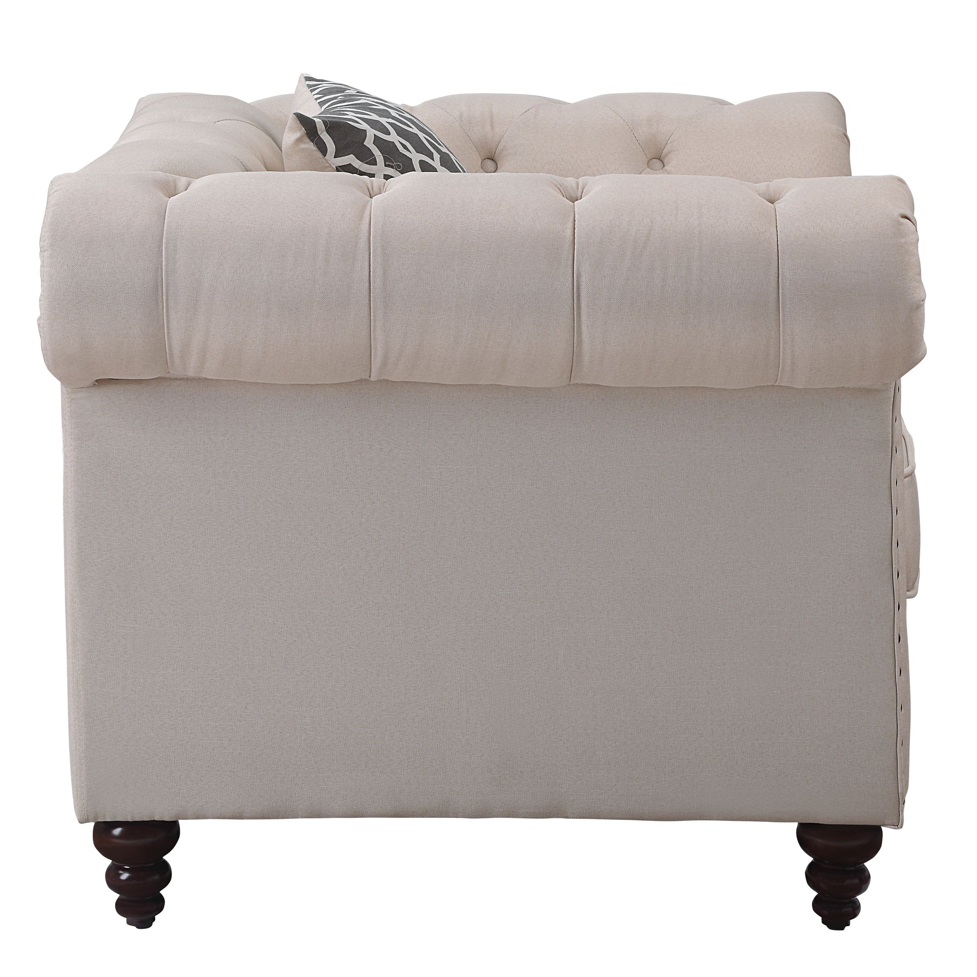Tufted beige linen armchair with decorative pillow and dark wood legs