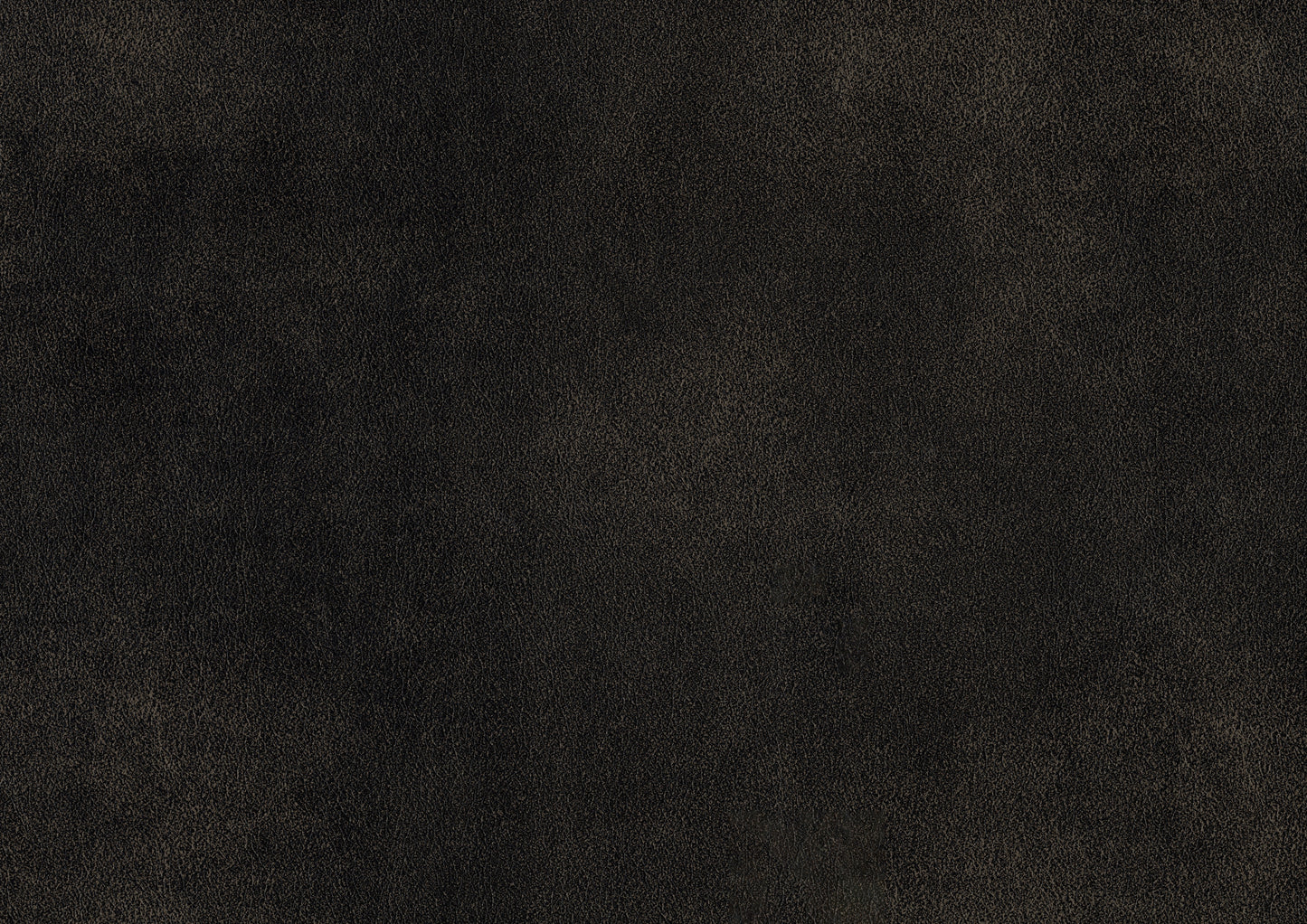Textured dark brown faux leather fabric closeup for upholstery