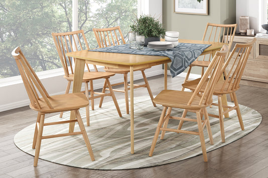 Natural wood dining chairs with spindle backs arranged around a light wood table