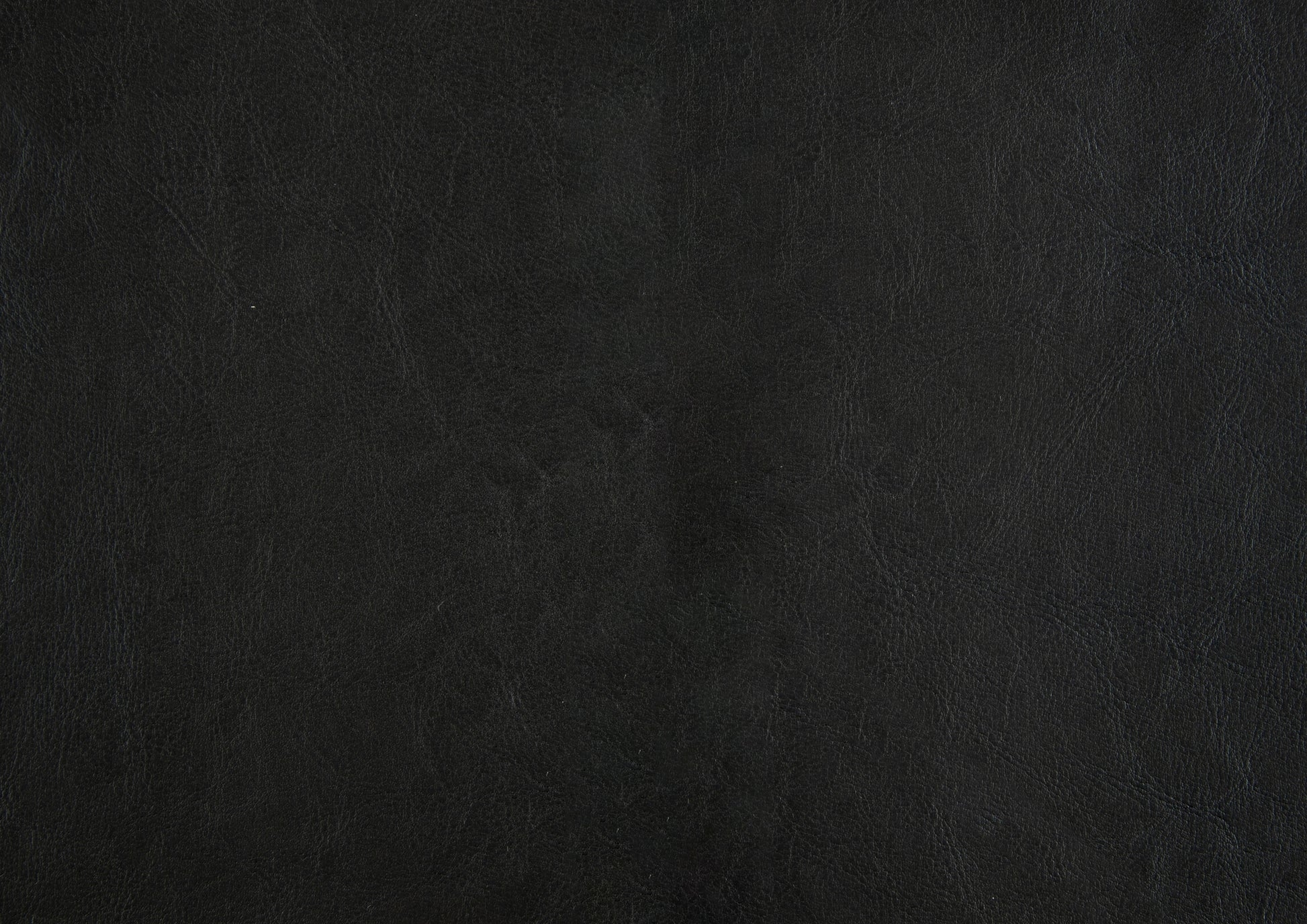 Closeup texture of black leather upholstery fabric