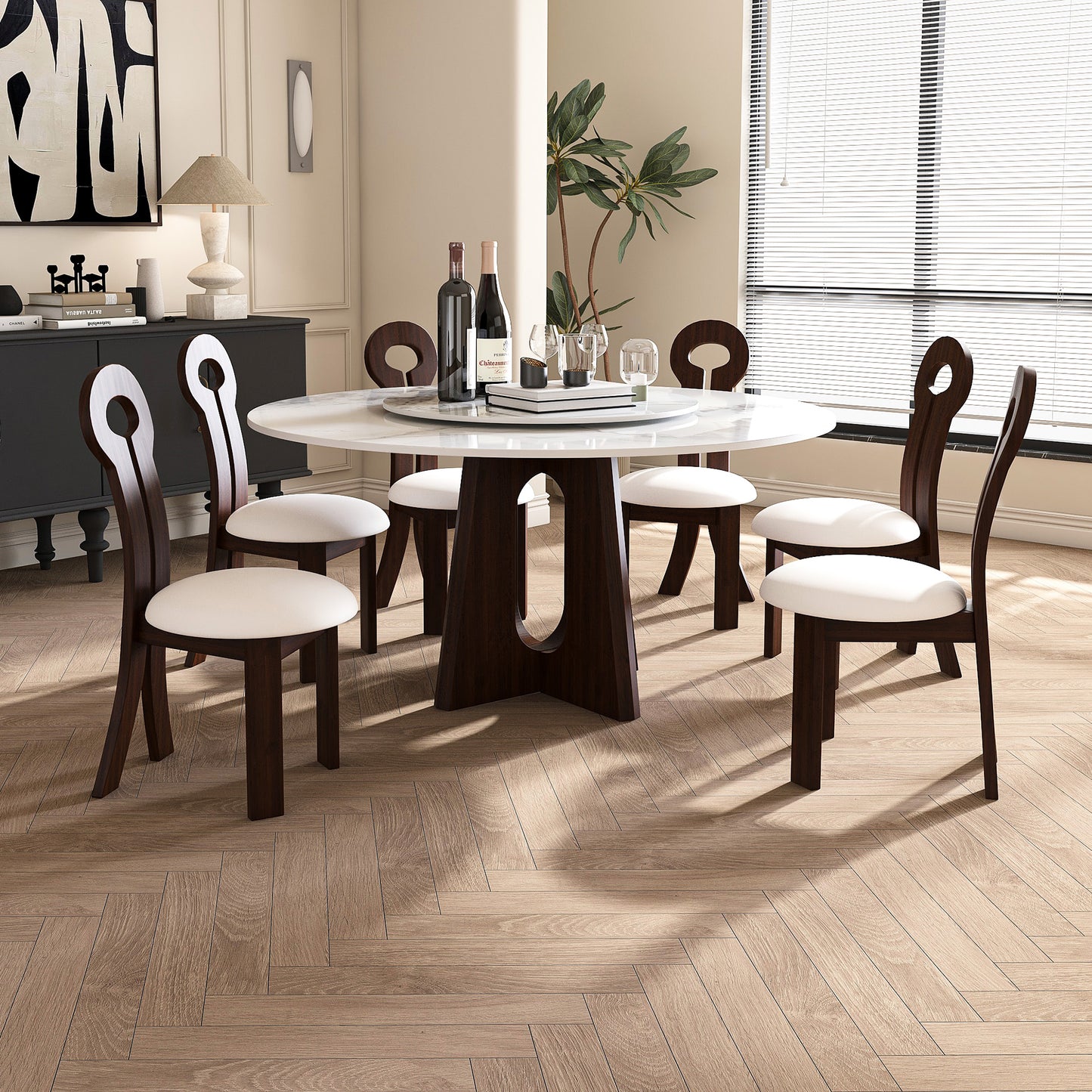 Modern round dining table with white marble top and dark wood base seats