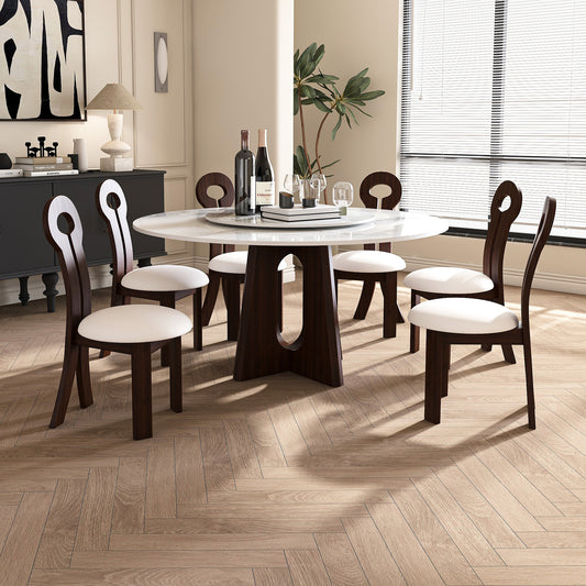 Modern round dining table with white marble top and dark wood base seats