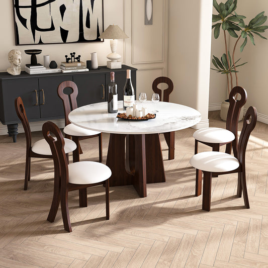 Modern round dining table with white marble top and dark wood base seating six
