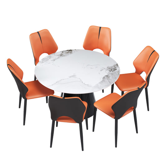 Round marble dining table with six orange and black accent chairs