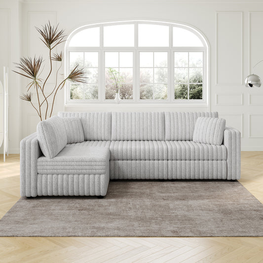Light gray plush sectional sofa with ribbed texture and a chaise lounge