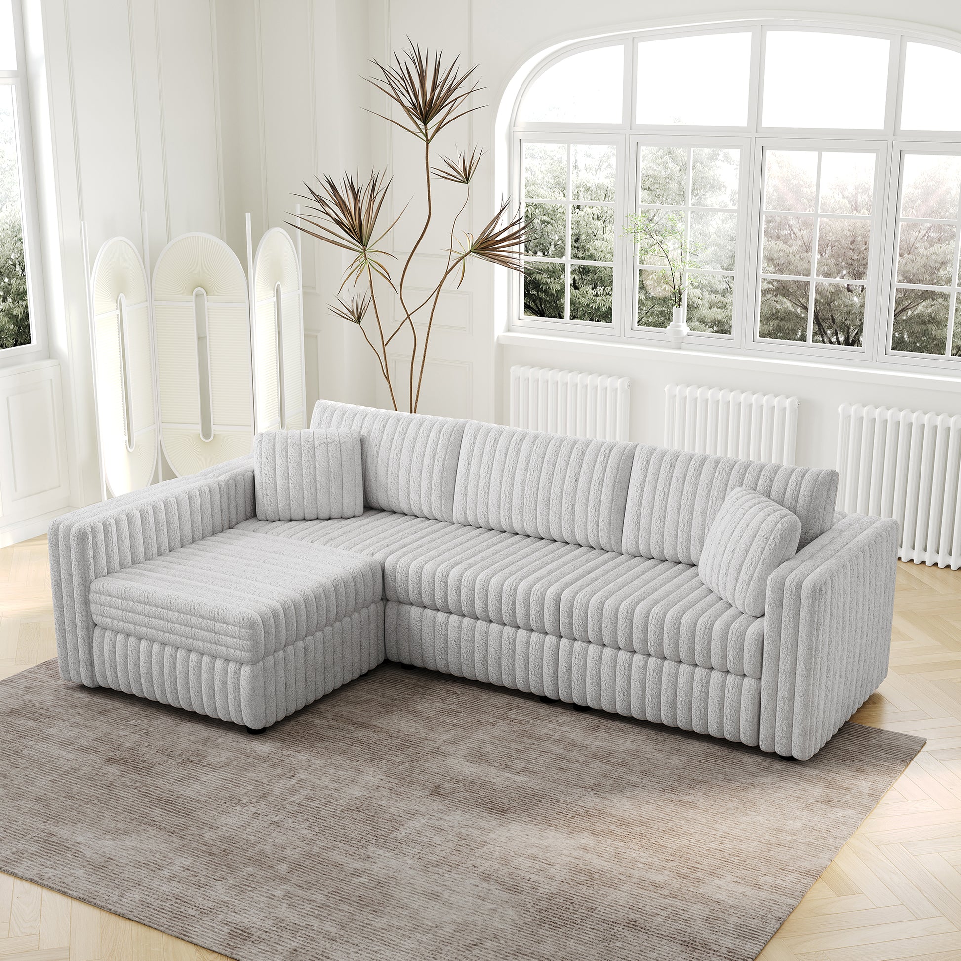 Plush corduroy sectional sofa in light grey with a chaise for contemporary living rooms