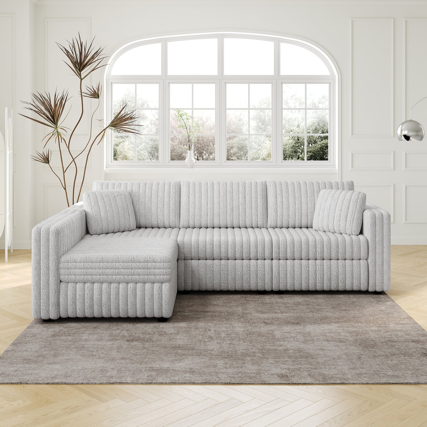 Light grey sectional sofa with ribbed texture and matching throw pillows