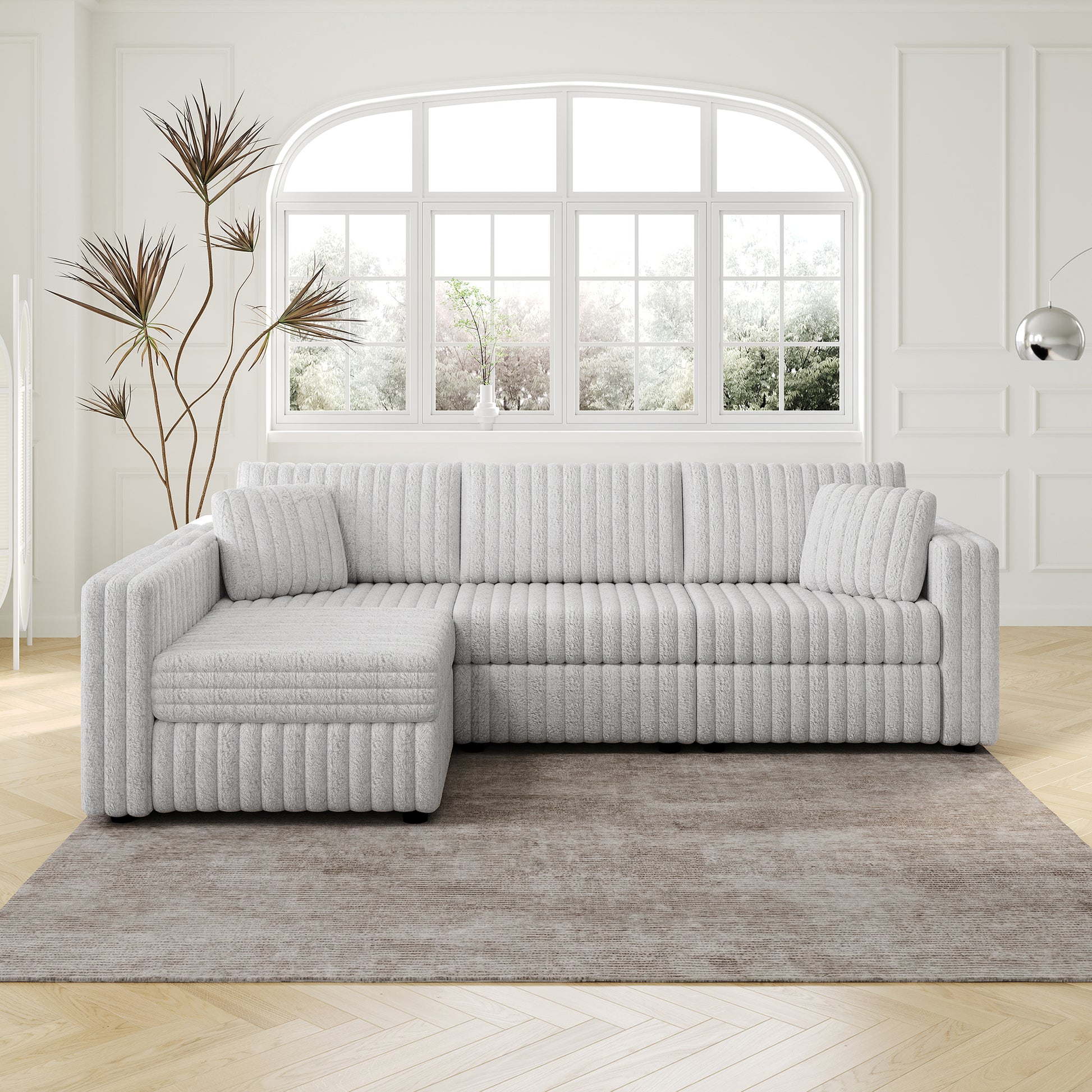 Light grey sectional sofa with ribbed texture and matching throw pillows