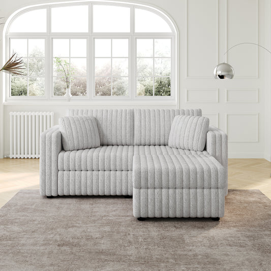 Plush textured light grey sectional sofa with chaise lounge and matching pillows