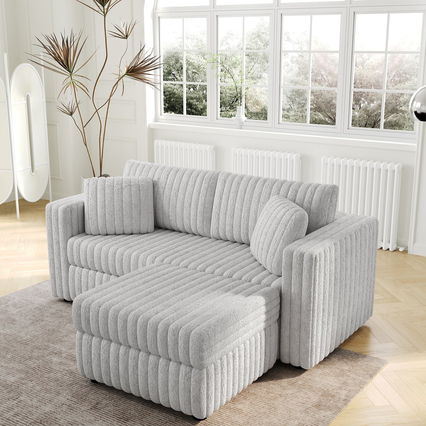 Plush grey sectional sofa with ribbed texture and matching throw pillows for cozy living spaces